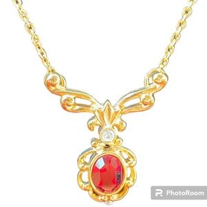 Avon? Retired? Gold toned necklace with red stone.